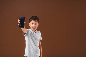 scared little boy, in shock from fact that I accidentally spoiled smartphone.