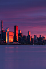 View on Midtown Manhattan skyscrapers during red sunlight with long exposure