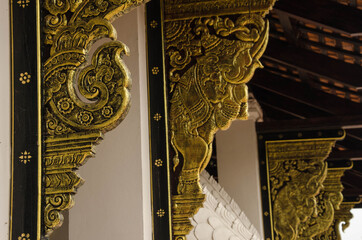 Beautiful golden pattern on corbels of Thai church © athapet