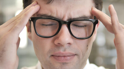 Close Up of Man in Glasses with Headache and Stress