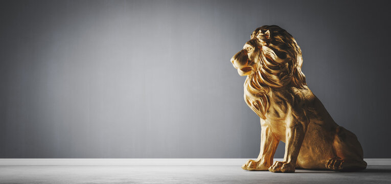 Golden Statue Of Lion, A Sculpture. Concept Of A Strength, Power