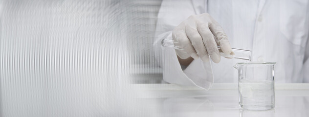 clean scientist in laboratory coat poring water from test tube into experimental beaker white science and technology banner background