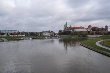 Fototapeta na wymiar General view of Wawel Royal Castle as seen from the south bank of the west bend of Vistula river, Krakow, Poland. 