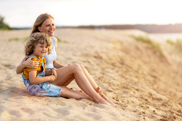 Mother and a child enjoying a day at the beach
