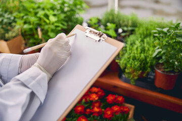 Botanist writing on a blank sheet of paper
