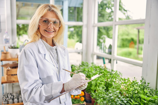 Joyous Woman Botanist Posing For The Camera