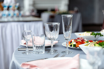 Table decorations for holidays and wedding dinner. Table set for holiday, event, party or wedding reception in outdoor restaurant