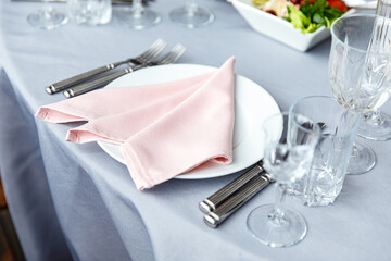 Table decorations for holidays and wedding dinner. Table set for holiday, event, party or wedding reception in outdoor restaurant