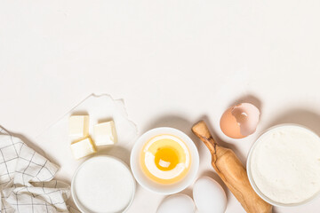 Baking ingredients at blue table top view.
