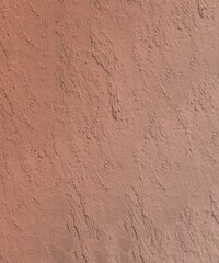 Stucco wall thick texture in light orange brown color