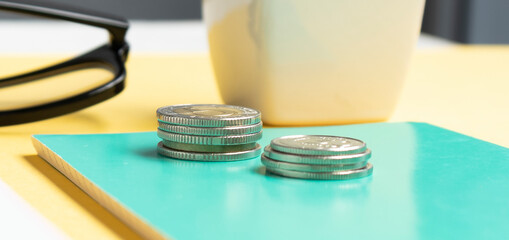 Coins on a table. Business concept. Coins stacked in ascending order.