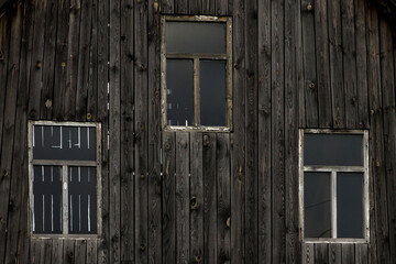 Fototapeta na wymiar Old windows on wooden planks wall