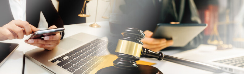 Business and lawyers discussing contract papers with brass scale on desk in office. Law, legal...