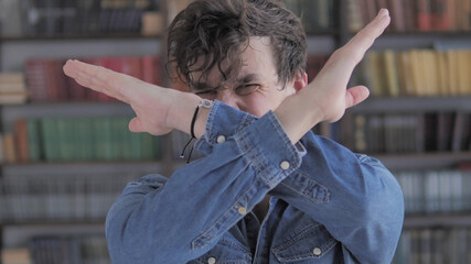 Rejecting, Disliking Gesture by Casual Young Man