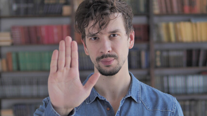 Stop Gesture by Casual Young Man, Denying and Rejecting