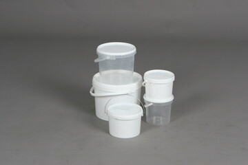 Plastic white containers, food, for liquids, on a white background, online store