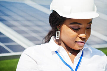African american technician check the maintenance of the solar panels. Black woman engineer at...
