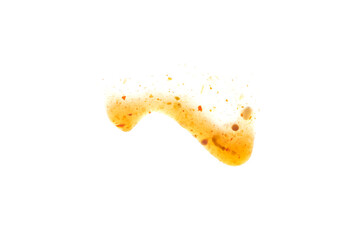 Smear of orange sauce Isolated on a white background. Glass dripping sauce