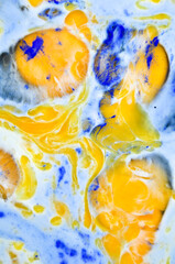 Fototapeta na wymiar Abstract crazy mix of blue paint, egg yolks and egg whites. 