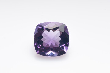 Natural violet amethyst on the white background