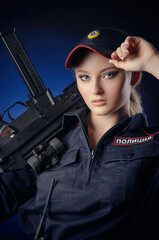 the girl in the police uniform with a gun is a Russian policeman with gun. English translation of 