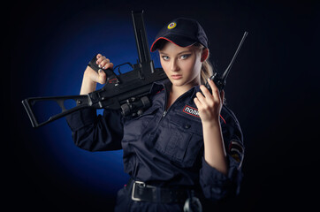 the girl in the police uniform with a gun is a Russian policeman with gun. English translation of 