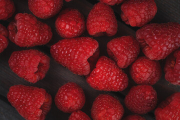 raspberry on a dark wooden background
