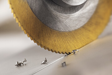 End mill cutting aluminium billet. Circular milling machine make hole in metal profile.