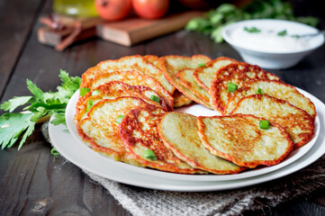 Potato fritters, grated vegetable pancakes or draniki, latkes