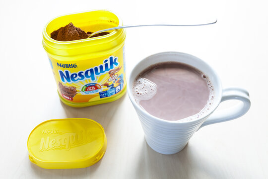 MOSCOW, RUSSIA - JUNE 16, 2020: above view of open jar of Nesquik with spoon and mup with cocoa on table. Nesquik Chocolate Powder was introduced in 1948 by Swiss company Nestle