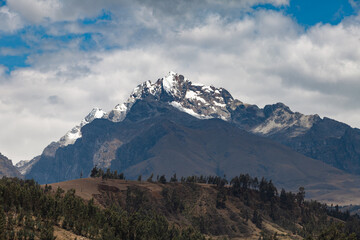 View of the Andes mountain from the city of Huaraz with clouds.