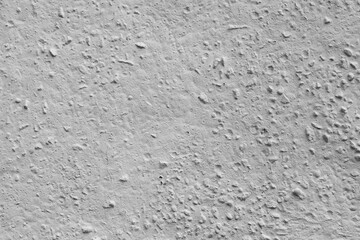 Obraz premium Concrete wall with stones painted white.