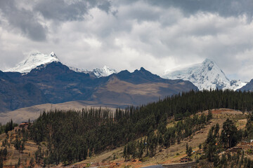 View of the Andes mountain from the city of Huaraz with clouds.
