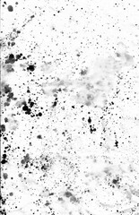Black ink stains, dots, spatter and splashes on white paper background