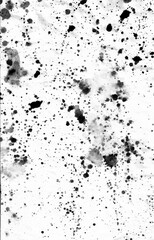 Black ink stains, dots, spatter and splashes on white paper background