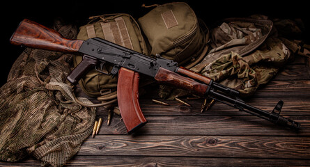 Classic Soviet AK machine gun on a wooden back. Weapons of Russia and the Soviet Union.