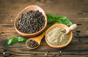 Black pepper in the wooden bowl