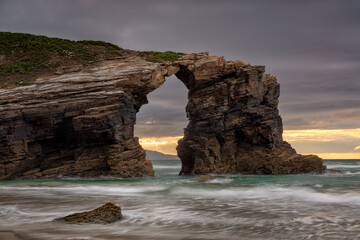 Fototapeta na wymiar Rock arch in the Playa de las Catedrales. Ribadeo, Galicia, Spain