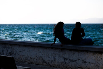 Young Couple Silhouette near the Seaside