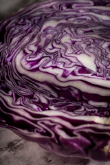 Purple cabbage lit on a wooden talbe.