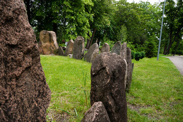 Megalithic stone circle Kriviy Rih city, Ukraine, city park. Summer time. Juicy grass among the ancient pagan sanctuary.