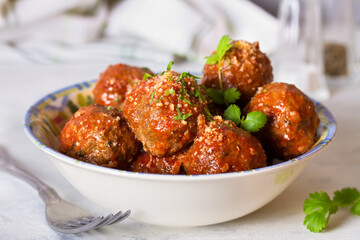 Meatballs in bowl on white background