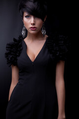 Fototapeta premium Young beautiful stylish girl posing in studio.