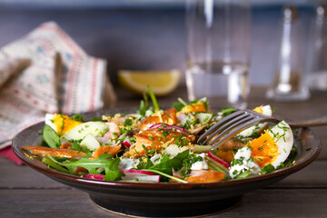 Smocked mackerel salad with eggs and radish. Healthy diet food