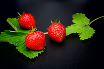strawberries on black background