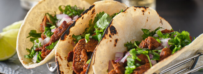 metal taco holder with three mexican carne asada street-tacos