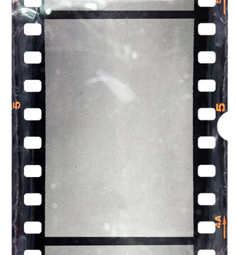 empty 35mm film frame with scratches, macro photo of film material