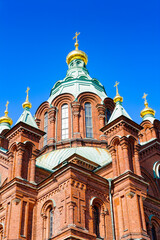Fototapeta na wymiar It's Uspenski Cathedral, an Eastern Orthodox cathedral in Helsinki, Finland, dedicated to the Dormition of the Theotokos (the Virgin Mary).