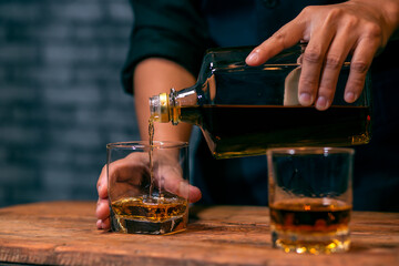 Bartender Serve Whiskey, on wood bar