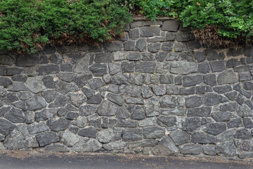 Old Medieval stone wall texture, with big gray stones
